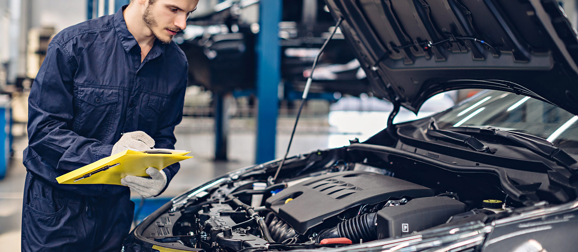 Mechanic checking over a vehicle during its service - Car Servicing Weston-super-Mare