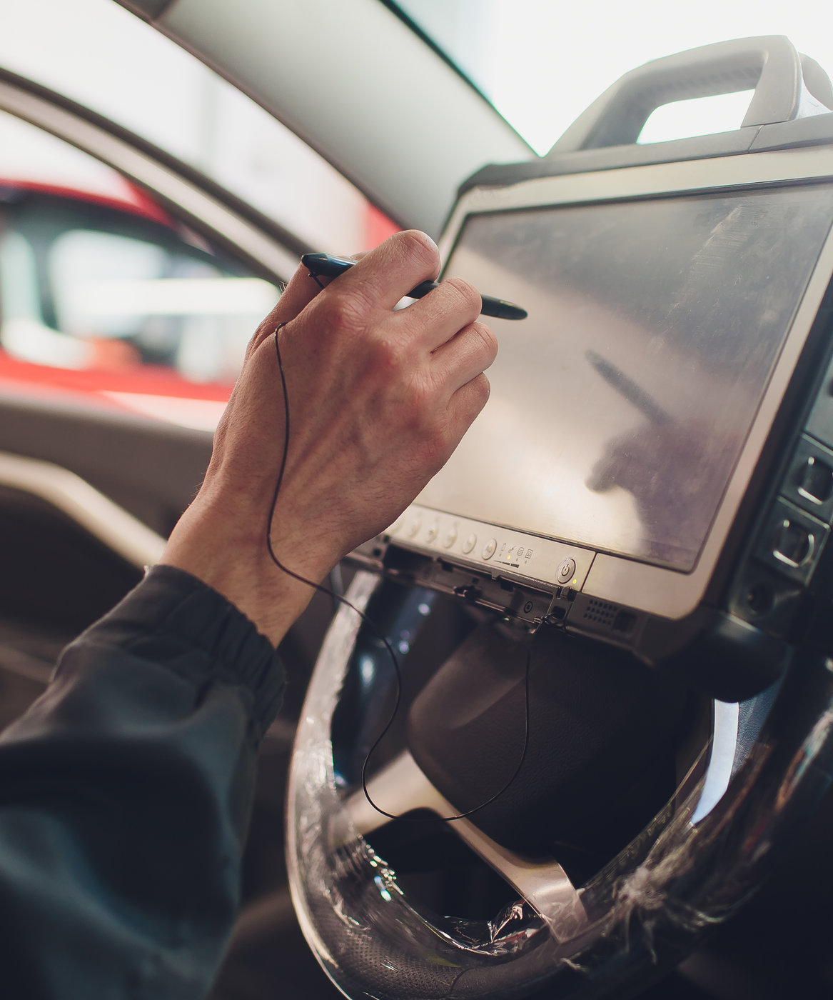 car mechanic maintains a vehicle with the help of a diagnostic computer - BMW & MINI Diagnostics in Tonbridge, Kent